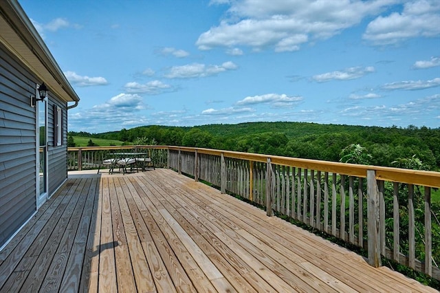 18 Coombs Hill Rd, Colrain, MA 01340 - wooden terrace featuring outdoor dining area and a view of trees