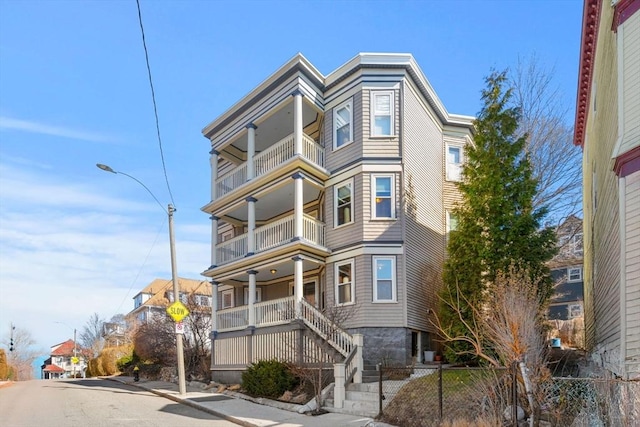 view of front of house featuring fence