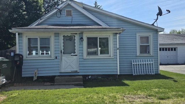 21 Eagle St, Ware, MA 01082 - view of front of home featuring entry steps, a front lawn, and a garage