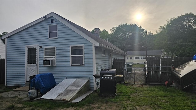 21 Eagle St, Ware, MA 01082 - rear view of house with a chimney and cooling unit