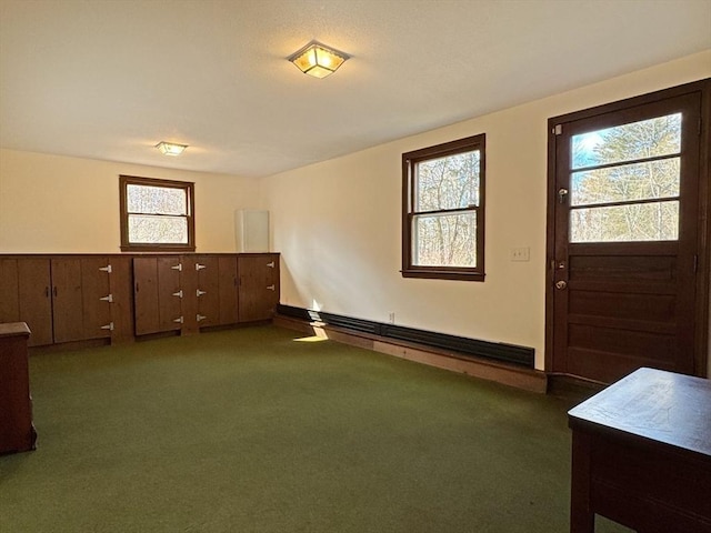 carpeted entryway featuring baseboard heating