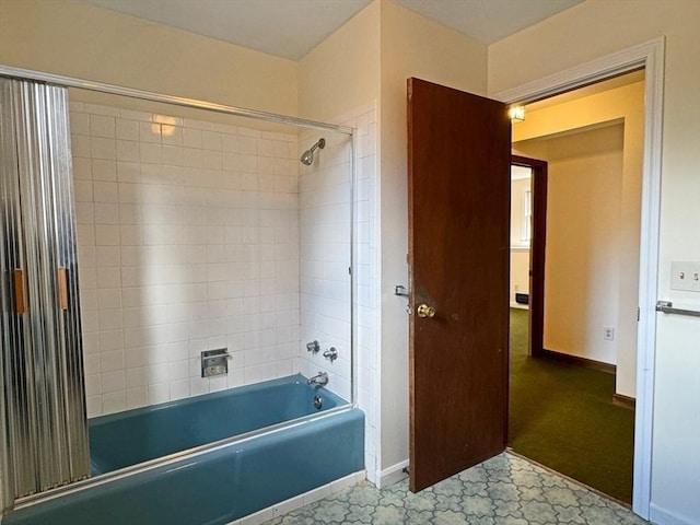 full bathroom with tile patterned floors, baseboards, and shower / washtub combination