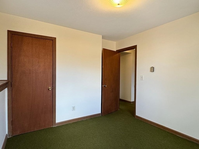 unfurnished bedroom with carpet and baseboards