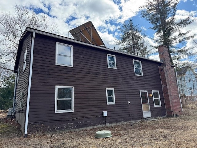 view of side of property with a chimney