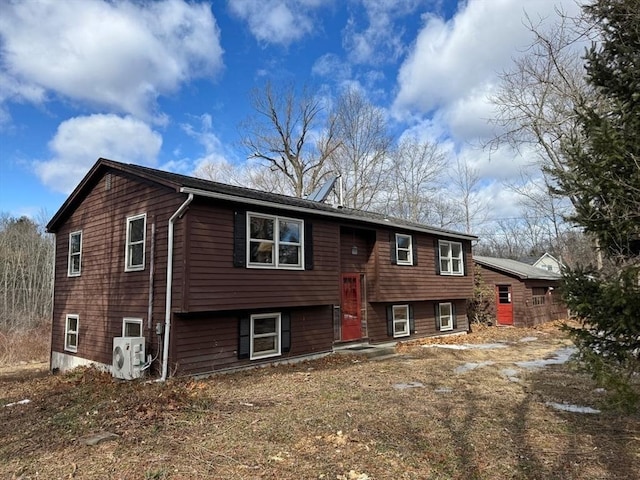 view of front of home with ac unit