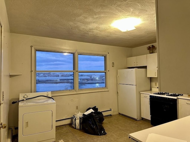 kitchen with a water view, white refrigerator, washer / dryer, white cabinetry, and gas range