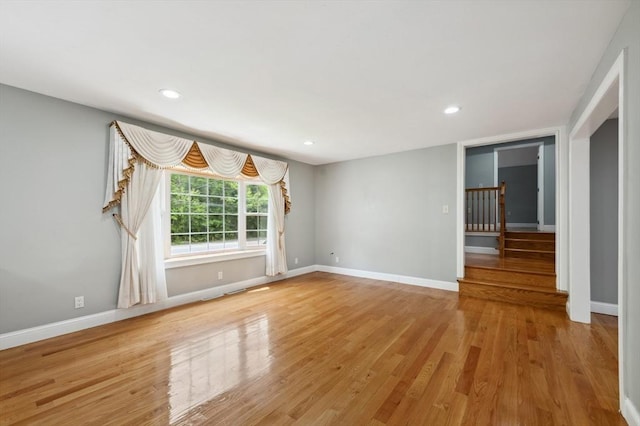451 Lincoln St, Abington, MA 02351 - unfurnished room with stairway, wood finished floors, baseboards, and recessed lighting