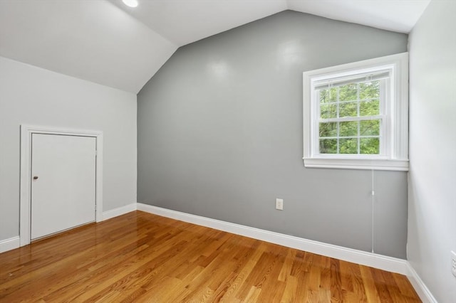 451 Lincoln St, Abington, MA 02351 - additional living space with lofted ceiling, light wood-style flooring, and baseboards