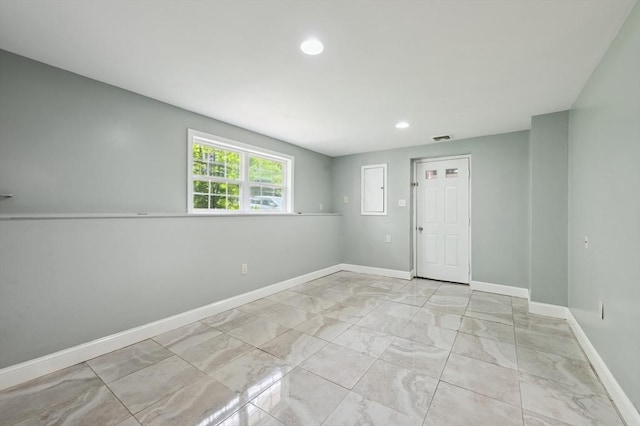 451 Lincoln St, Abington, MA 02351 - spare room with baseboards, marble look tiles, and recessed lighting