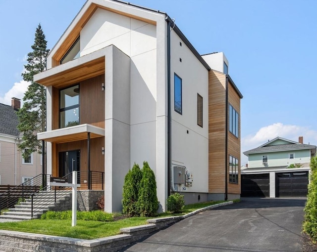 33 Conwell Ave, Somerville, MA 02144 - contemporary house with stucco siding and driveway
