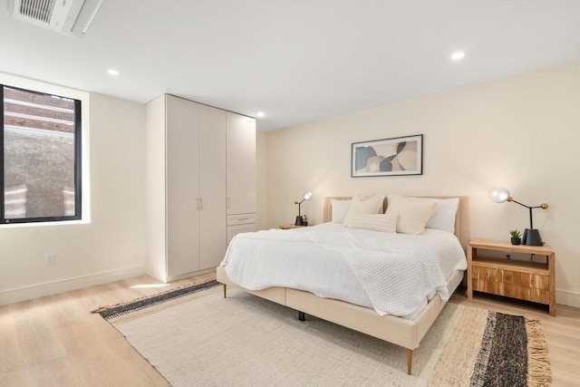 33 Conwell Ave, Somerville, MA 02144 - bedroom with light wood-style flooring and recessed lighting