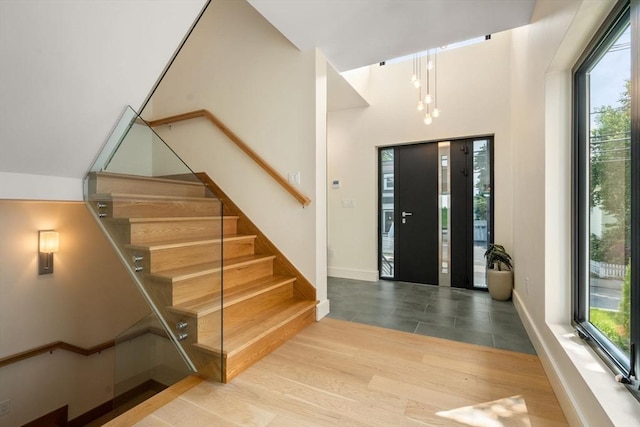 33 Conwell Ave, Somerville, MA 02144 - entrance foyer with stairway and wood finished floors