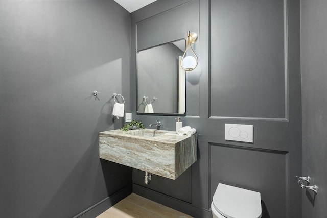 33 Conwell Ave, Somerville, MA 02144 - bathroom with toilet and wood finished floors