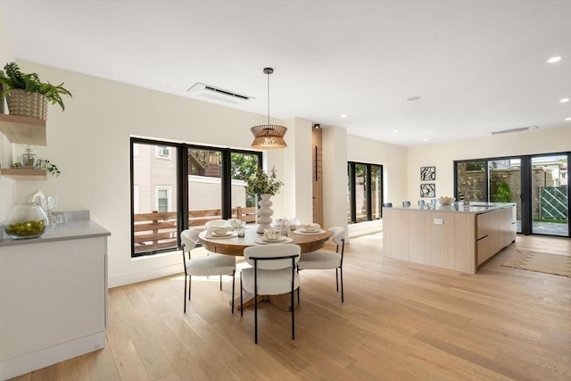 33 Conwell Ave, Somerville, MA 02144 - dining room featuring light wood-style floors, healthy amount of natural light, and recessed lighting