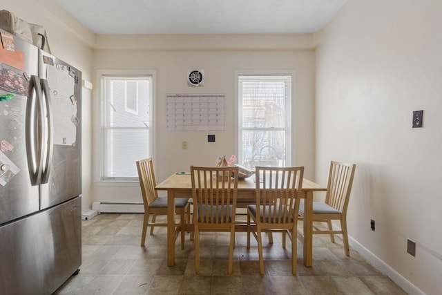 dining room with baseboard heating and baseboards