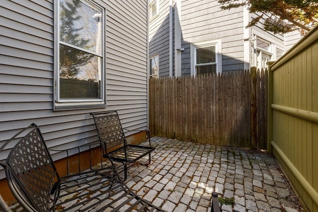 view of patio featuring fence