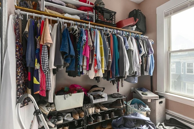 spacious closet with baseboard heating