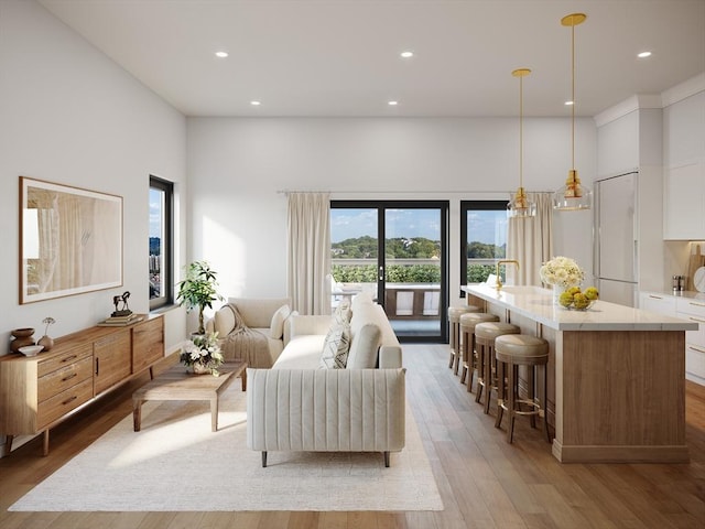 living area featuring recessed lighting and light wood-style flooring