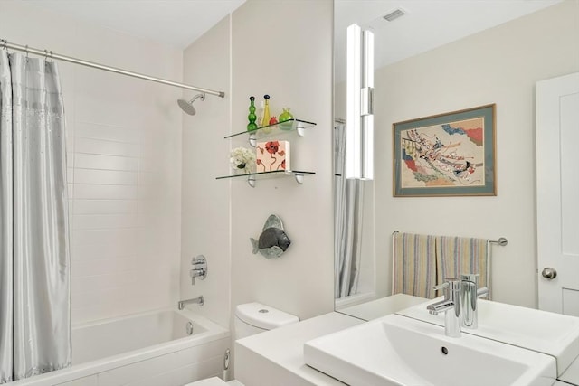 bathroom featuring a sink, toilet, and shower / bath combination with curtain