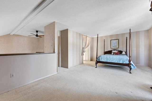 carpeted bedroom featuring lofted ceiling with beams