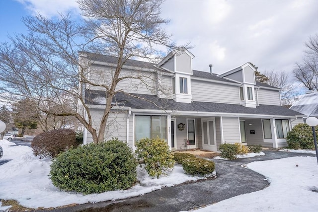 view of front of home with a shingled roof