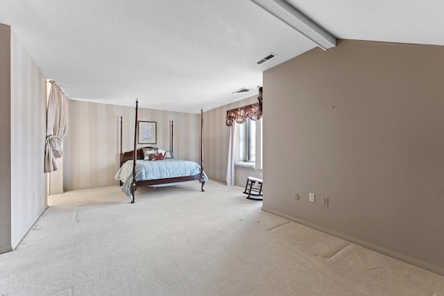 bedroom featuring carpet floors, visible vents, and vaulted ceiling with beams