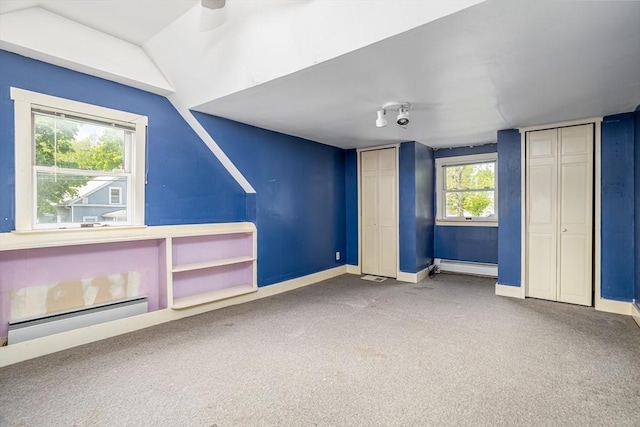 18 Main St, Templeton, MA 01468 - unfurnished bedroom with a baseboard heating unit, carpet flooring, multiple closets, baseboards, and vaulted ceiling