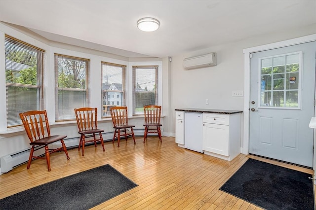 18 Main St, Templeton, MA 01468 - sitting room featuring a wall mounted AC and light wood-style flooring