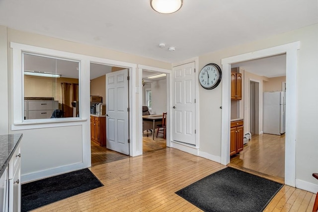 18 Main St, Templeton, MA 01468 - entrance foyer with light wood-style floors, baseboards, and a baseboard heating unit