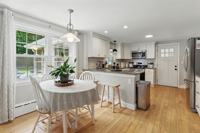905 Stony Hill Rd, Wilbraham, MA 01095 - dining space with light wood-style flooring, baseboard heating, and recessed lighting