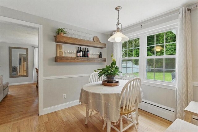 905 Stony Hill Rd, Wilbraham, MA 01095 - dining room featuring a baseboard heating unit, light wood-style floors, and baseboards