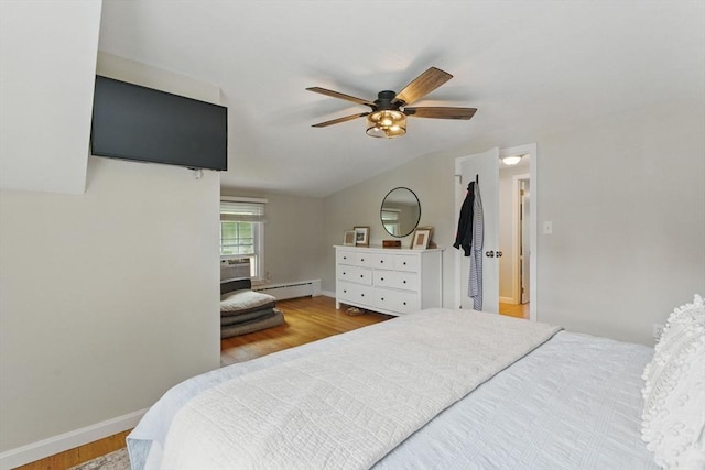 905 Stony Hill Rd, Wilbraham, MA 01095 - bedroom featuring a baseboard heating unit, wood finished floors, baseboards, vaulted ceiling, and a ceiling fan