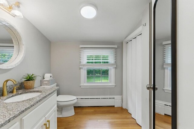905 Stony Hill Rd, Wilbraham, MA 01095 - bathroom with baseboard heating, vanity, healthy amount of natural light, and toilet