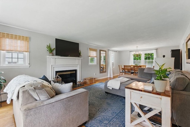 905 Stony Hill Rd, Wilbraham, MA 01095 - living area with light wood-style floors and a glass covered fireplace