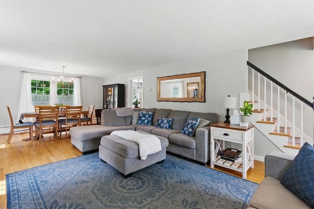 905 Stony Hill Rd, Wilbraham, MA 01095 - living area with wood finished floors, stairway, a chandelier, and baseboards