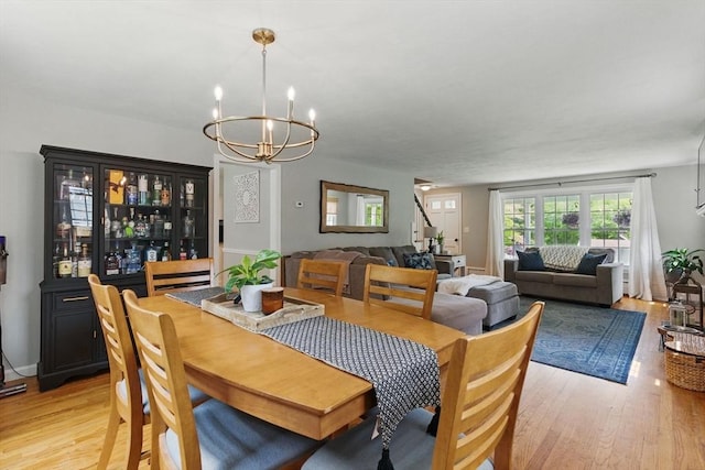 905 Stony Hill Rd, Wilbraham, MA 01095 - dining space featuring a chandelier and light wood-style floors