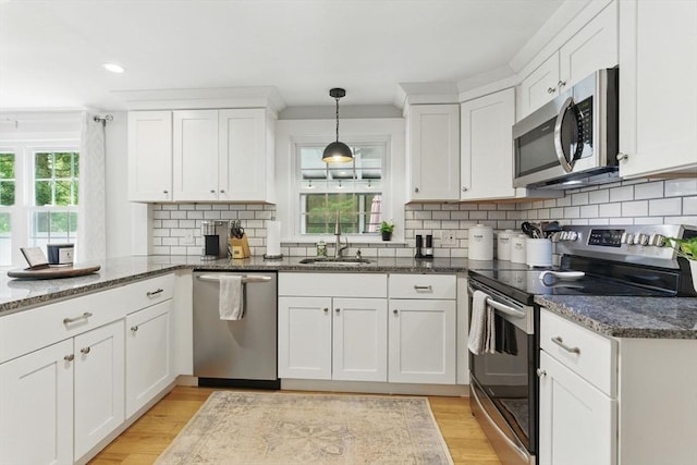 905 Stony Hill Rd, Wilbraham, MA 01095 - kitchen featuring stainless steel appliances, a sink, white cabinets, and recessed lighting