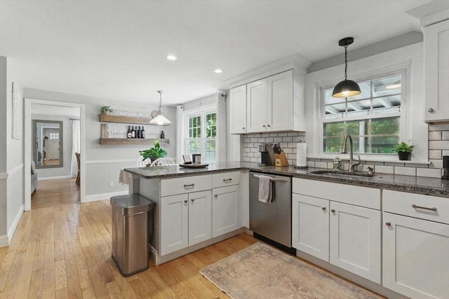 905 Stony Hill Rd, Wilbraham, MA 01095 - kitchen featuring stainless steel dishwasher, a sink, a peninsula, white cabinets, and light wood finished floors