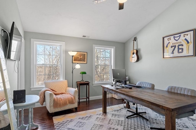 office space featuring a wealth of natural light, visible vents, and vaulted ceiling