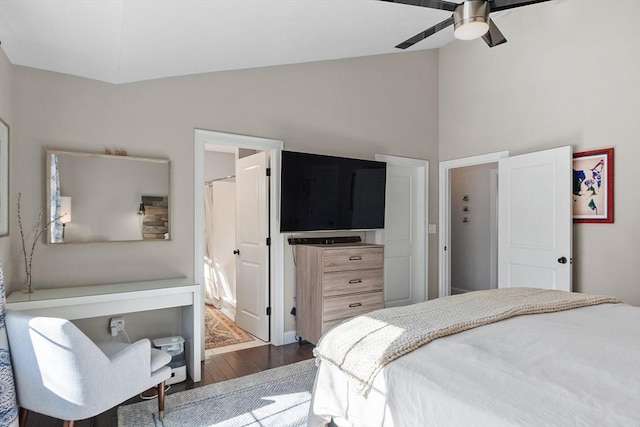 bedroom with lofted ceiling, ceiling fan, and wood finished floors