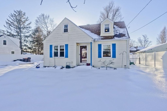 new england style home with fence