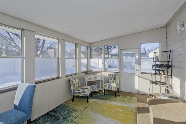 sunroom / solarium featuring vaulted ceiling