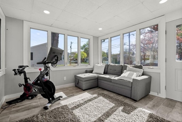 interior space featuring recessed lighting, baseboards, plenty of natural light, and wood finished floors