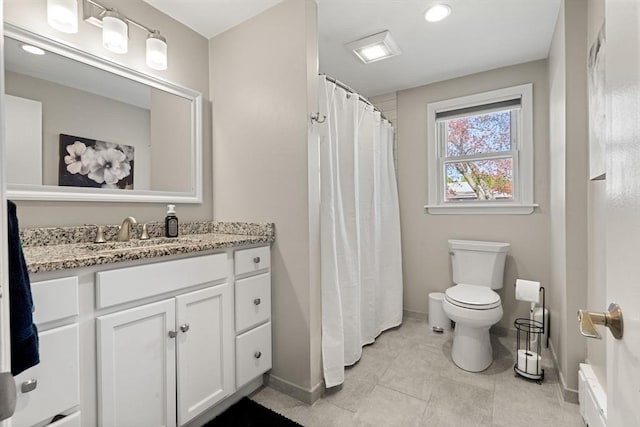 full bath featuring vanity, toilet, baseboards, recessed lighting, and tile patterned floors