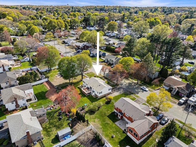 birds eye view of property with a residential view
