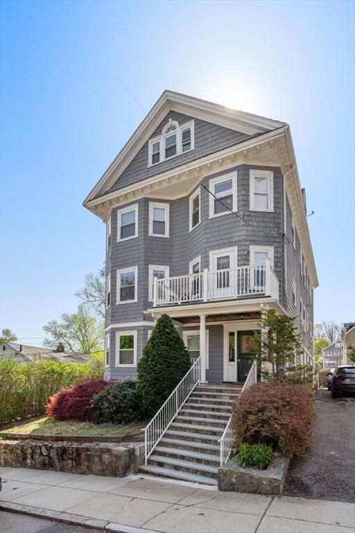 view of front of house with covered porch and stairs