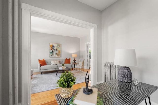 living area featuring baseboards