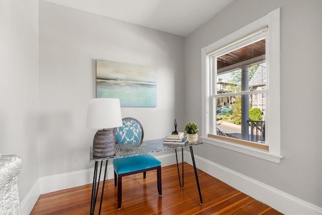 sitting room with wood finished floors, baseboards, and an office area