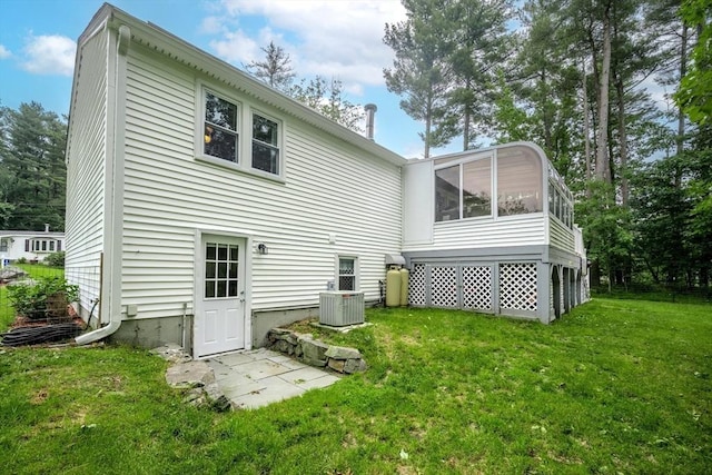 61 Wright Rd, Ayer, MA 01432 - back of property with a sunroom and a yard