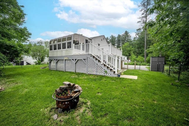 61 Wright Rd, Ayer, MA 01432 - rear view of property with a sunroom, stairs, a lawn, and a shed